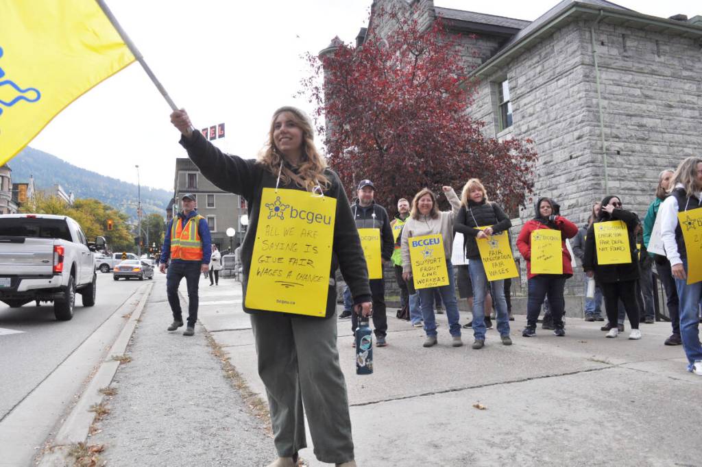 Striking members of the B.C. General Employees’ Union demonstrate in front of Nelson City Hall on Oct. 17. (Tyler Harper/Nelson Star)